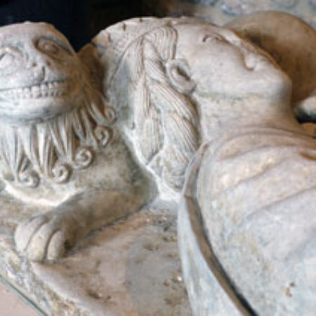 Fig 4 A grinning lion supports her crowned head